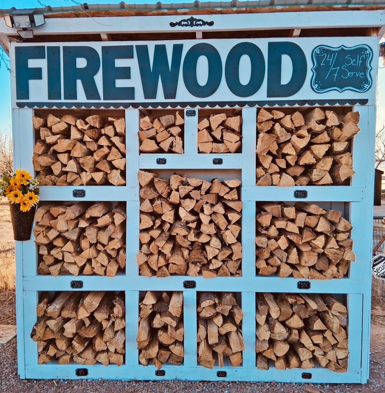 Pine firewood stand at Lost Sheep Farm — 24/7 self serve